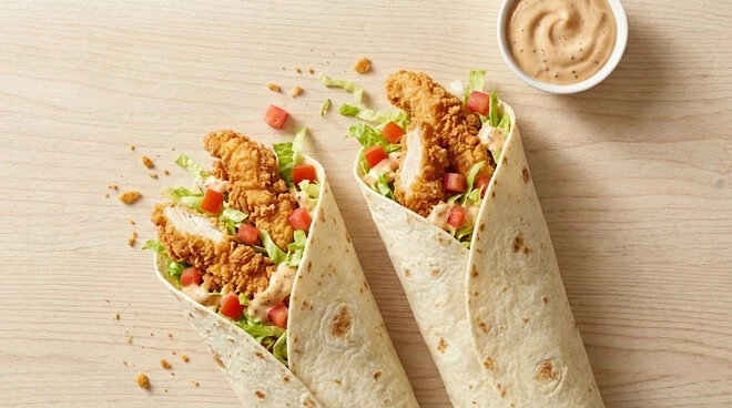 Loaded Twister sandwich from the KFC Madinah menu filled with crispy chicken strips and fresh toppings.